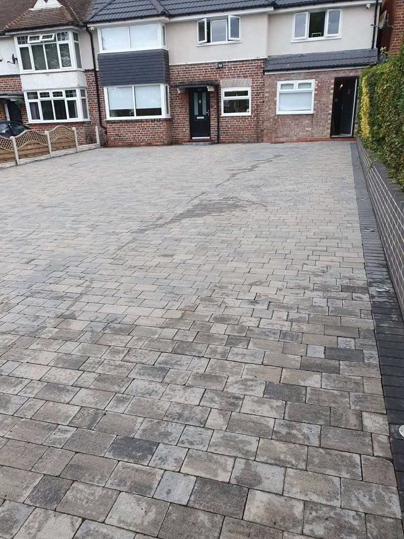 Large block paving driveway before cleaning